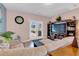 Cozy living room with a large sectional sofa, entertainment center, and easy access to the patio at 568 Affinity Dr., Myrtle Beach, SC 29588