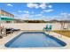 Inviting in-ground pool with clear blue water and surrounding patio furniture at 568 Affinity Dr., Myrtle Beach, SC 29588