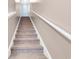 Carpeted staircase featuring a white handrail and leading to the upper level at 568 Affinity Dr., Myrtle Beach, SC 29588