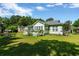 Charming home with a lush green backyard and a lovely deck, perfect for outdoor relaxation at 1305 Conifer Ct., Murrells Inlet, SC 29576