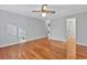 Spacious bedroom with hardwood floors, neutral walls, and a ceiling fan at 1305 Conifer Ct., Murrells Inlet, SC 29576