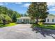 Charming home with green shutters, well-manicured lawn, and spacious driveway at 1305 Conifer Ct., Murrells Inlet, SC 29576