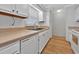 Well-lit kitchen featuring white cabinets, laminate counters, and essential appliances at 1305 Conifer Ct., Murrells Inlet, SC 29576