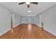 Bright living room with hardwood floors, ceiling fan, and lots of natural light at 1305 Conifer Ct., Murrells Inlet, SC 29576