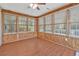 Bright sunroom with multiple windows and wood paneled walls at 1305 Conifer Ct., Murrells Inlet, SC 29576