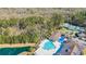 Aerial view showcasing the community's pool, pond, and other amenities nestled in lush greenery at 138 Sugar Loaf Ln., Murrells Inlet, SC 29576
