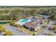 Aerial shot of community pool, tennis courts, pond and community buildings surrounded by mature trees at 138 Sugar Loaf Ln., Murrells Inlet, SC 29576