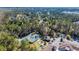 The aerial shot shows tennis courts, a clubhouse, pool, a bocce ball court, and other amenities at 138 Sugar Loaf Ln., Murrells Inlet, SC 29576