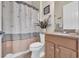 Well-maintained bathroom with a vanity, toilet, shower with curtain, and decorative accents at 138 Sugar Loaf Ln., Murrells Inlet, SC 29576