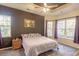 Spacious bedroom with tray ceiling, large windows, and comfortable decor at 138 Sugar Loaf Ln., Murrells Inlet, SC 29576