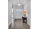 Welcoming foyer with tile flooring, a decorative light fixture, and a view to a spacious living area at 138 Sugar Loaf Ln., Murrells Inlet, SC 29576