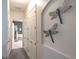 Hallway with coat closet leading to bathroom with glass enclosed shower at 138 Sugar Loaf Ln., Murrells Inlet, SC 29576