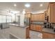Well-lit kitchen with stainless steel appliances, granite countertops, and custom wood cabinetry at 138 Sugar Loaf Ln., Murrells Inlet, SC 29576