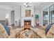 Charming living room showcasing a cozy fireplace, stylish decor, tile flooring, and an inviting atmosphere at 138 Sugar Loaf Ln., Murrells Inlet, SC 29576
