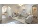 Cozy living room featuring neutral colors, tile floors, a ceiling fan, and plenty of natural light at 138 Sugar Loaf Ln., Murrells Inlet, SC 29576