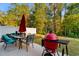 Outdoor patio area with barbecue grill, table, and chairs, perfect for outdoor entertaining at 1604 Carsens Ferry Dr., Conway, SC 29526