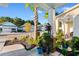 Inviting front porch with views of the neighborhood street, tropical landscaping, and neighboring homes at 1604 Carsens Ferry Dr., Conway, SC 29526