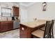 Well-lit kitchen featuring stainless steel appliances and a breakfast bar with seating for two at 1604 Carsens Ferry Dr., Conway, SC 29526