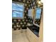 Charming bathroom featuring a toilet, vanity, and a large window at 323 Sea Turtle Dr., Myrtle Beach, SC 29588