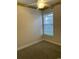 Cozy bedroom with ceiling fan, window, and neutral carpet flooring at 323 Sea Turtle Dr., Myrtle Beach, SC 29588