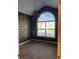 Cozy bedroom featuring an arched window and an ornate light fixture at 323 Sea Turtle Dr., Myrtle Beach, SC 29588