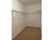Empty walk-in closet featuring metal shelving and carpet at 323 Sea Turtle Dr., Myrtle Beach, SC 29588