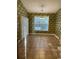 Charming dining area bathed in natural light, showcasing elegant floral wallpaper at 323 Sea Turtle Dr., Myrtle Beach, SC 29588