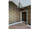 A room with decorative wallpaper and an ornate light fixture with parrot design, awaiting your personal touch at 323 Sea Turtle Dr., Myrtle Beach, SC 29588