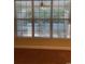 Window view of the outdoor greenery and white picket fence, bringing natural light and a touch of charm at 323 Sea Turtle Dr., Myrtle Beach, SC 29588