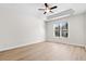 Spacious bedroom featuring hardwood floors and a large window at 3613 White Oleander Ct., North Myrtle Beach, SC 29582