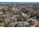Aerial view of the house nestled in trees in a coastal neighborhood with a view of the ocean at 538 Calhoun Dr., Murrells Inlet, SC 29576