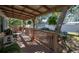Tranquil covered porch offering ample space for seating and enjoying the peaceful, private backyard at 538 Calhoun Dr., Murrells Inlet, SC 29576