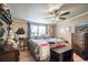 Bedroom with wood floors, a ceiling fan, and a large window that provide plenty of natural light at 538 Calhoun Dr., Murrells Inlet, SC 29576