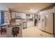 Bright kitchen with white cabinets, modern appliances, an island, and an adjacent breakfast nook at 538 Calhoun Dr., Murrells Inlet, SC 29576