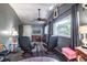 Living room with two leather chairs, views, desk, and a ceiling fan for added comfort at 538 Calhoun Dr., Murrells Inlet, SC 29576