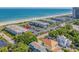 Aerial view of coastal real estate featuring condo buildings and ocean views on a clear, sunny day at 5601 N Ocean Blvd. # E-316, Myrtle Beach, SC 29577
