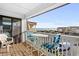 Relax on this inviting balcony with ocean views and comfortable seating, perfect for enjoying the coastal breeze at 5601 N Ocean Blvd. # E-316, Myrtle Beach, SC 29577