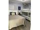 Cozy bedroom with a double bed and bunk beds at 5601 N Ocean Blvd. # E-316, Myrtle Beach, SC 29577