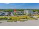 Bright daytime shot of condo building with well-maintained landscaping, parking and beach access at 5601 N Ocean Blvd. # E-316, Myrtle Beach, SC 29577
