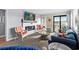 Bright living room features a modern fireplace, comfortable seating, and balcony access with scenic views at 5601 N Ocean Blvd. # E-316, Myrtle Beach, SC 29577