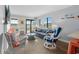 Charming living area featuring wicker furniture, beach-themed decor, and sliding glass doors to a balcony at 5601 N Ocean Blvd. # E-316, Myrtle Beach, SC 29577