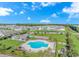 Community aerial view featuring pool, playground, and blue clubhouse at 830 San Marco Ct. # C, Myrtle Beach, SC 29579