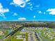 Community aerial view featuring ponds, clubhouse, and blue sky at 830 San Marco Ct. # C, Myrtle Beach, SC 29579