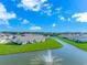 Beautiful aerial view of homes surrounding a pond with a fountain at 830 San Marco Ct. # C, Myrtle Beach, SC 29579