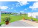 Backyard view with lush green grass, pond, and fountain at 830 San Marco Ct. # C, Myrtle Beach, SC 29579