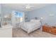 Light-filled bedroom with a view of the lake and a comfortable white metal bed frame at 830 San Marco Ct. # C, Myrtle Beach, SC 29579