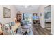 Inviting living room featuring wood flooring, a ceiling fan, and sliding glass doors to the outside at 830 San Marco Ct. # C, Myrtle Beach, SC 29579