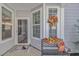 Welcoming porch with fall decor, a bench, and a festive wreath adding charm to the entrance at 830 San Marco Ct. # C, Myrtle Beach, SC 29579