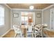 Charming dining room featuring stylish chairs, a light fixture, and hardwood floors at 108 N Hazard St., Georgetown, SC 29440