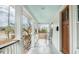 Inviting front porch featuring a seating area and a stylish, light-blue ceiling at 108 N Hazard St., Georgetown, SC 29440